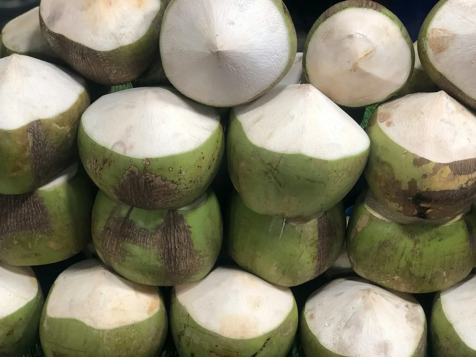 a pile of coconuts sitting on top of each other