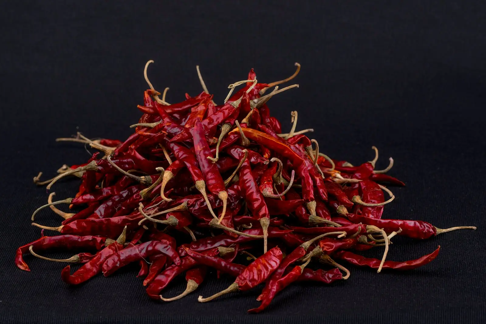 red chili on black surface