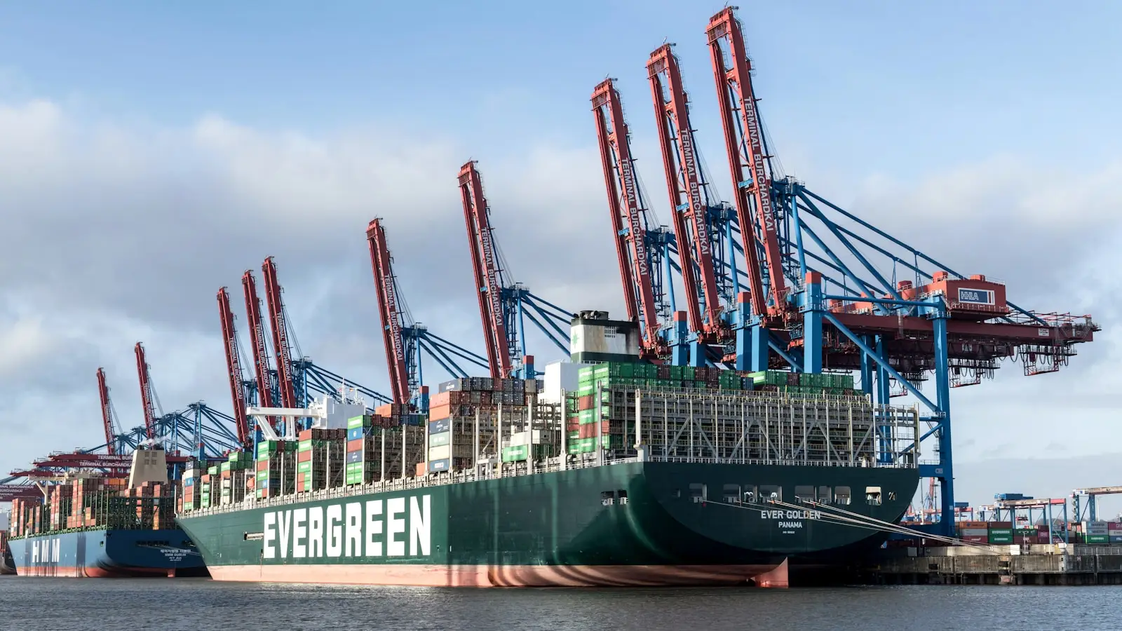 a large cargo ship docked at a dock