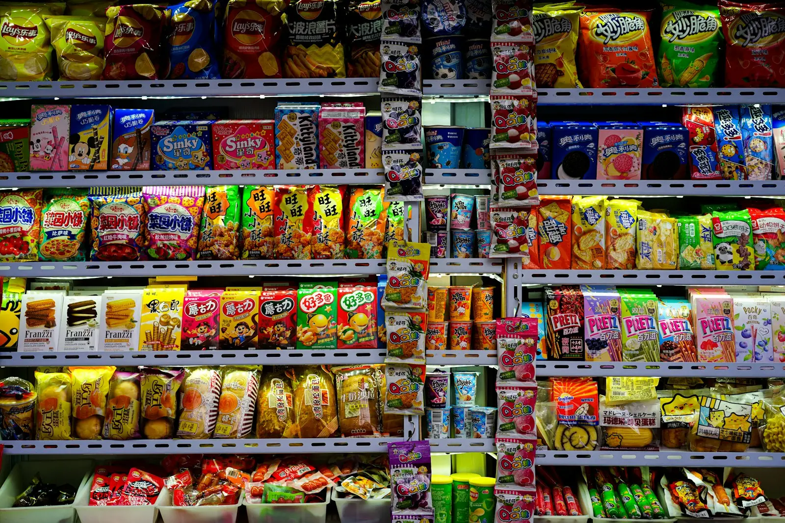 a display in a grocery store filled with lots of food