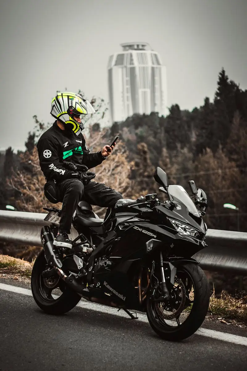 Man Sitting on Motorcycle on Road